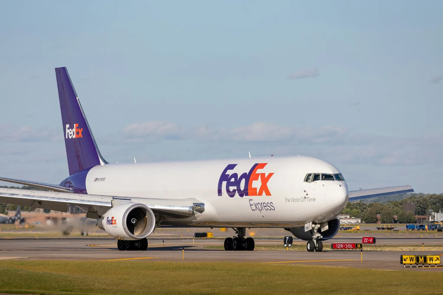 A FedEx plane getting ready for takeoff.