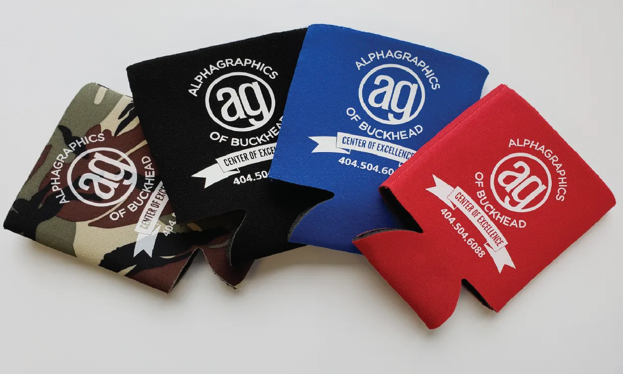 An Image of four custom branded drink coozies in a variety of colors