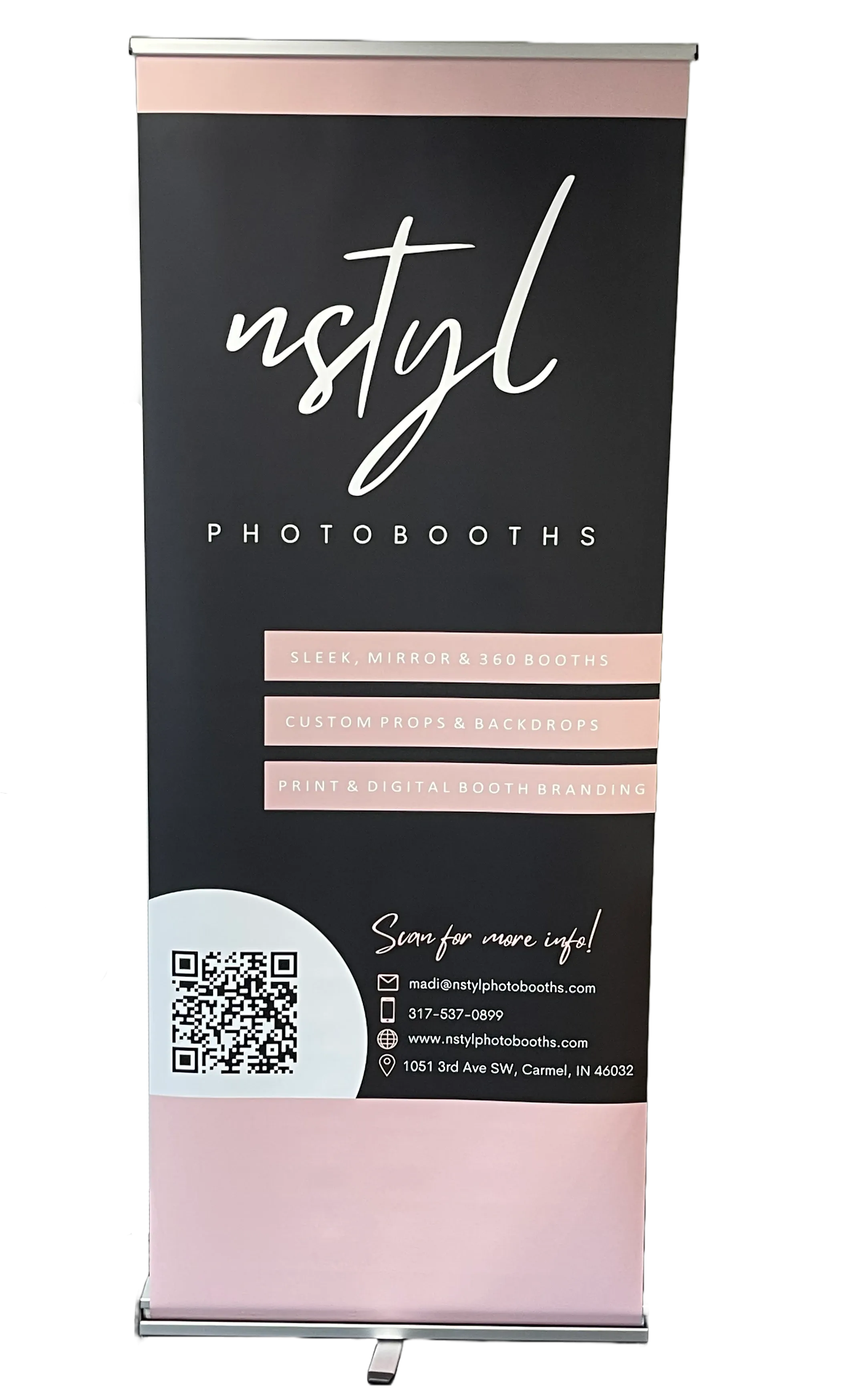 Branded retractable banner for Nstyl Photobooths featuring services offered, contact information, and a QR code for more info.