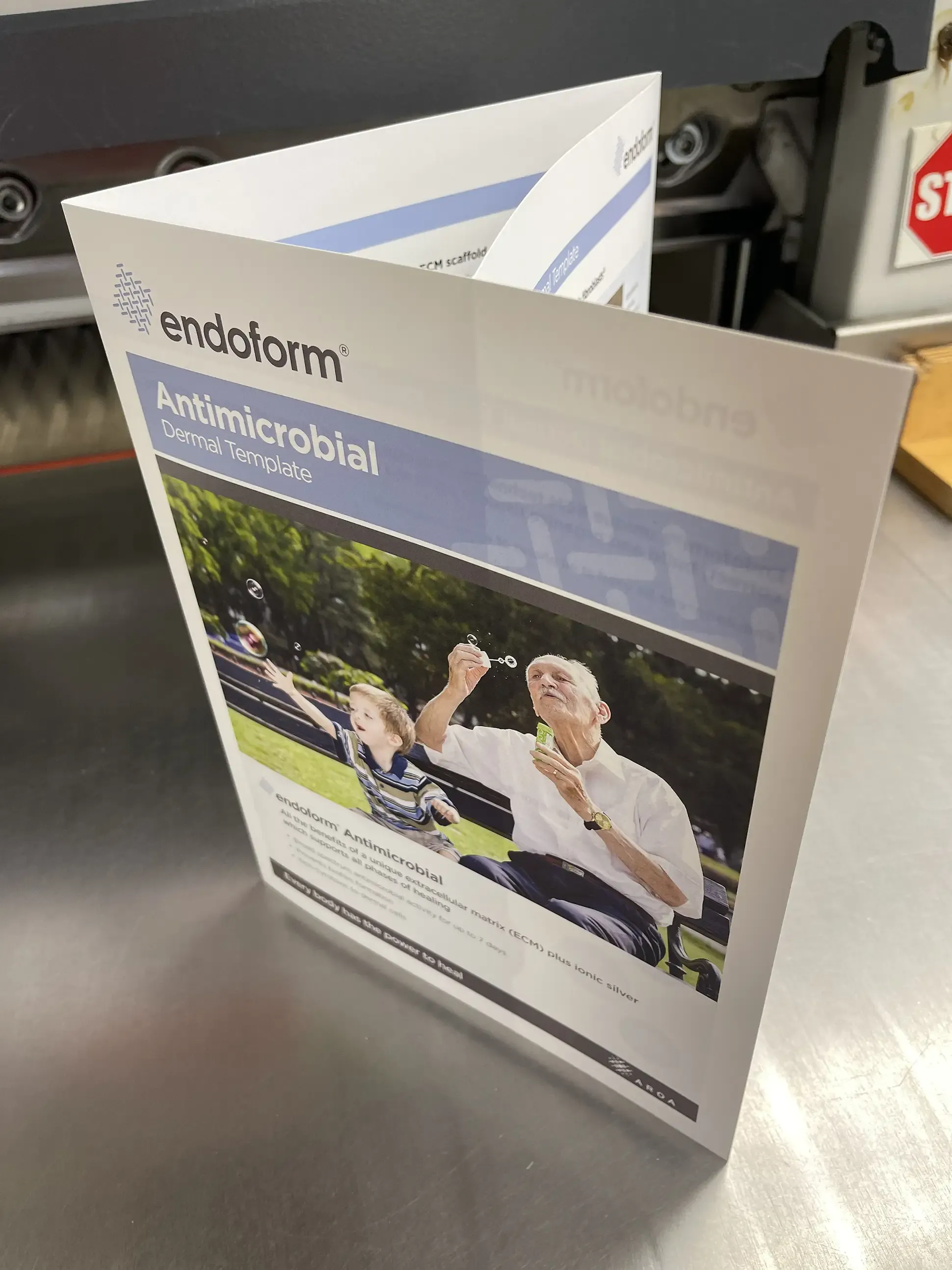 Professionally printed booklet with medical and life sciences information, showcasing detailed layouts and imagery