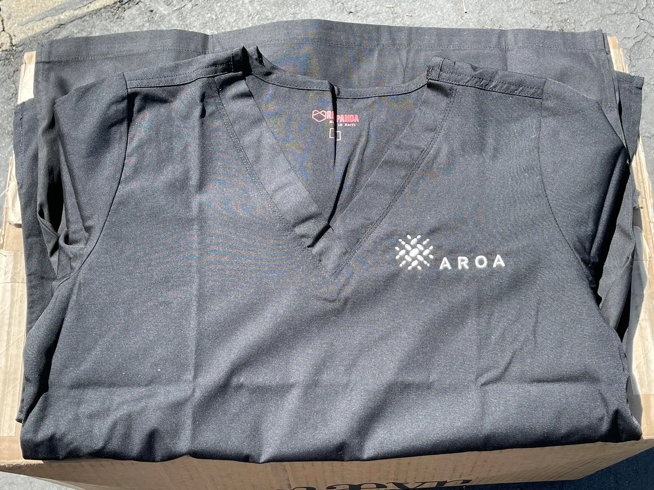 Custom-branded medical apparel with embroidered logo for a life sciences organization in San Diego