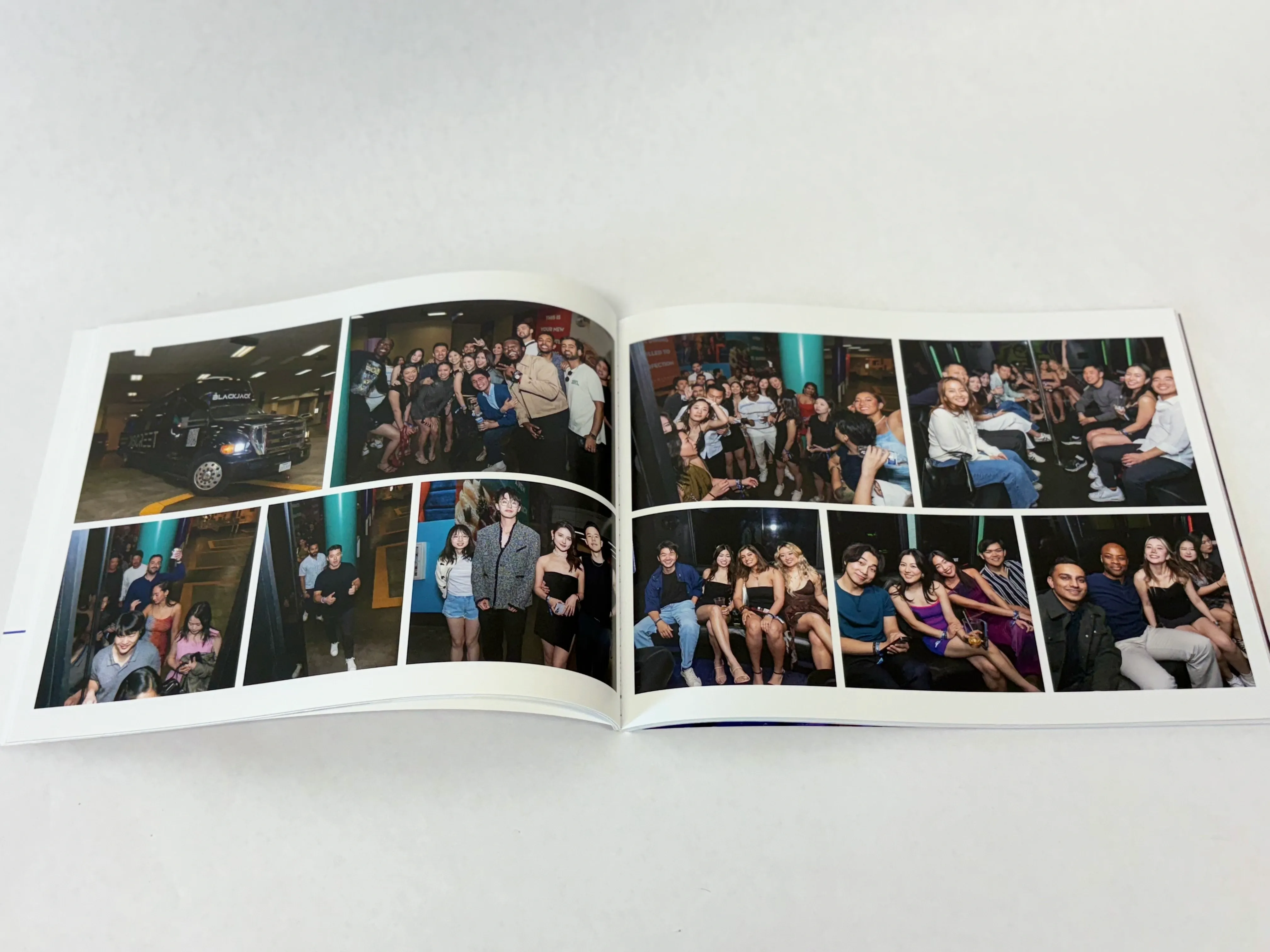  An open, landscape-style photo book showing full-color event photos laid out in a grid format.