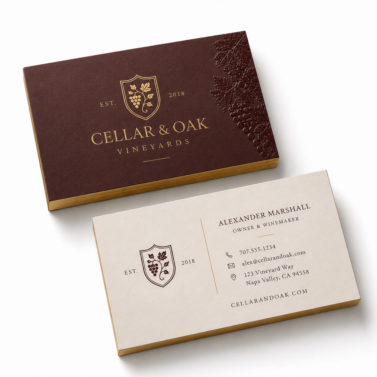 Gold-foil business cards with a painted edge, fanned to show the colored core